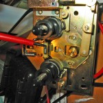 idler tire touching the part the screw driver is pointing to
